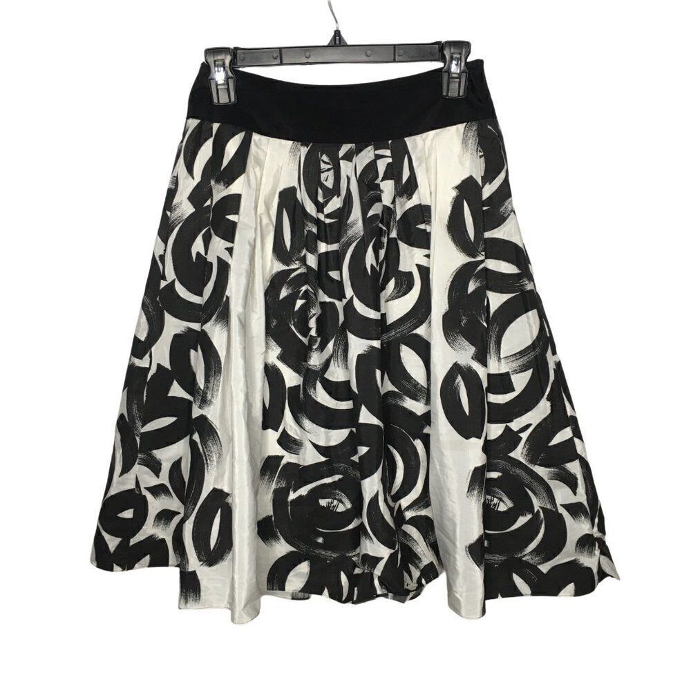 Young women black and white silky polyester skirt